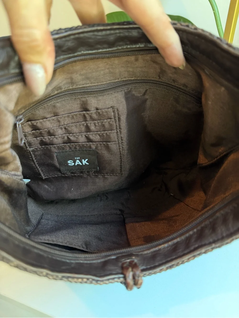 The Sak ‘Leather Woven Bag with Horn Closure.